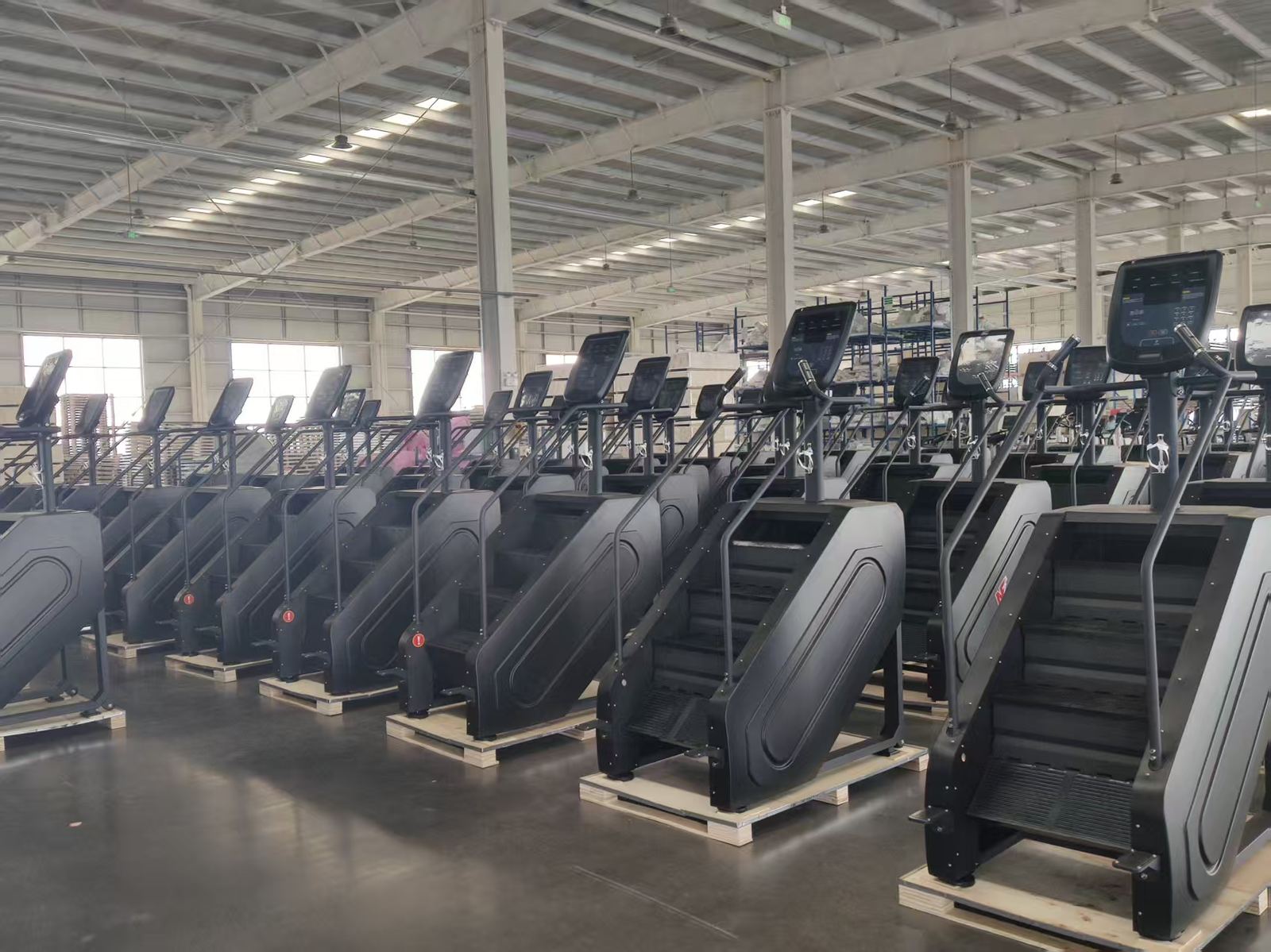 Yingdong factory floor — commercial stair climbers ready for export